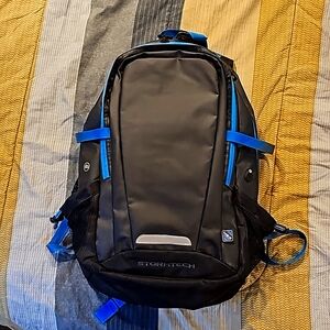 Stormtech backpack,  graphite and blue in color.
